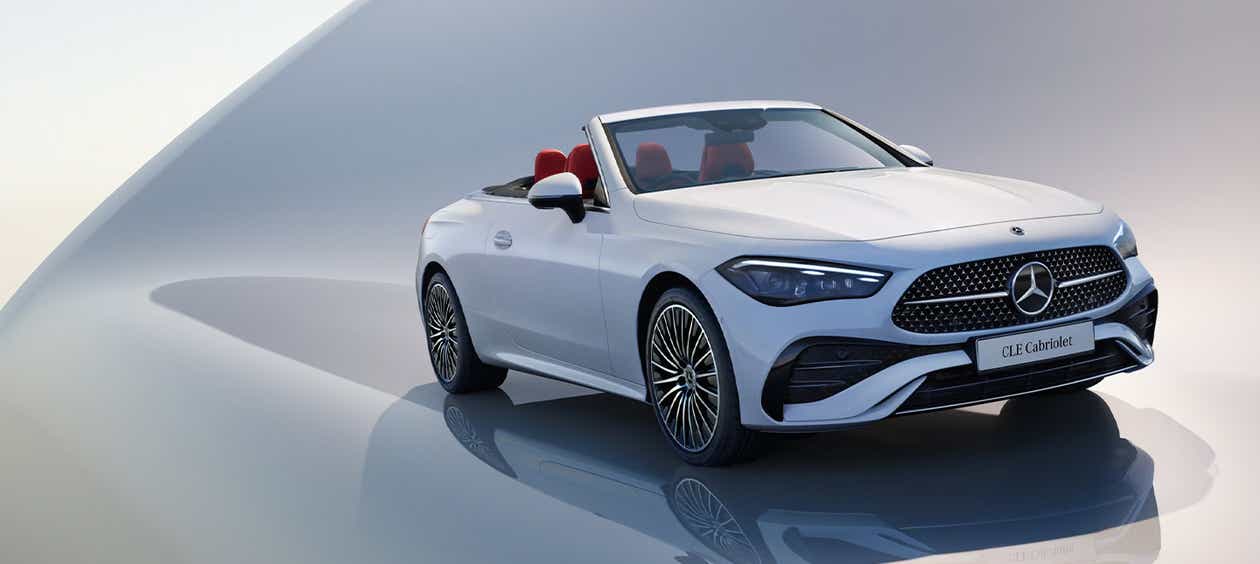 front three-quarter view of a Opalite White Mercedes-Benz CLE Cabriolet