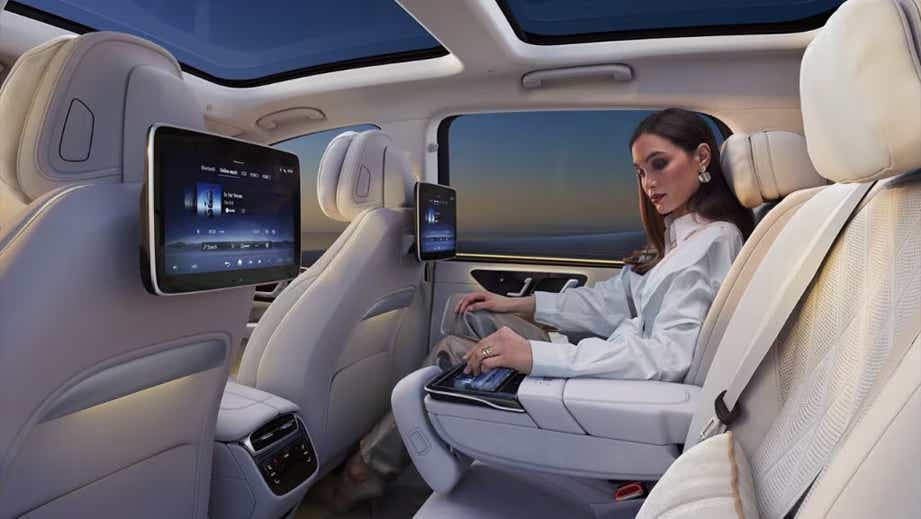 rear seat interior of a Mercedes-Benz EQS SUV with entertainment screens