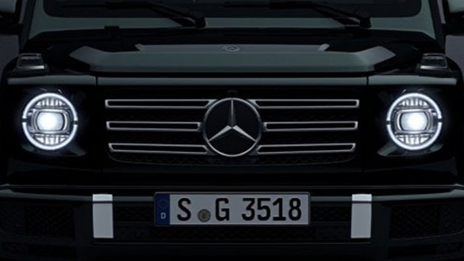 front grille and headlights of a Polar White Non Metallic Mercedes-Benz G-Class