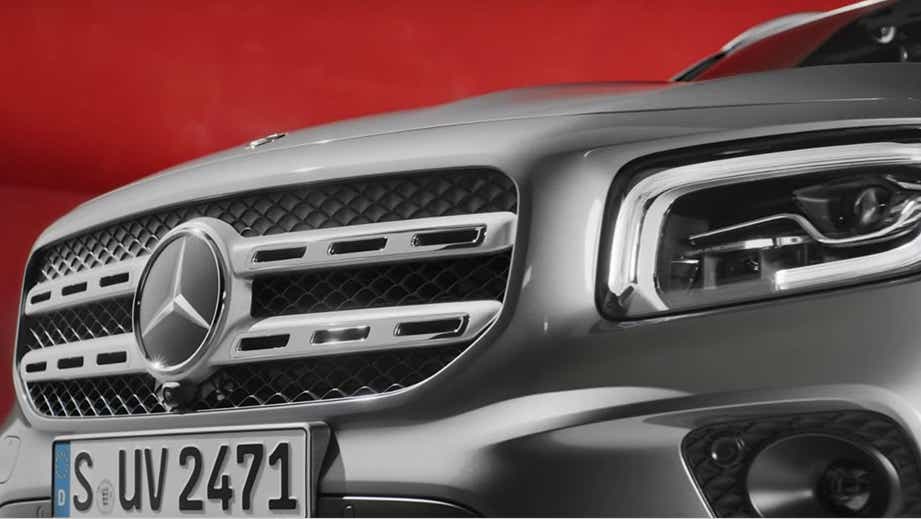 Front grille and headlight close-up of a Polar White Mercedes-Benz GLB