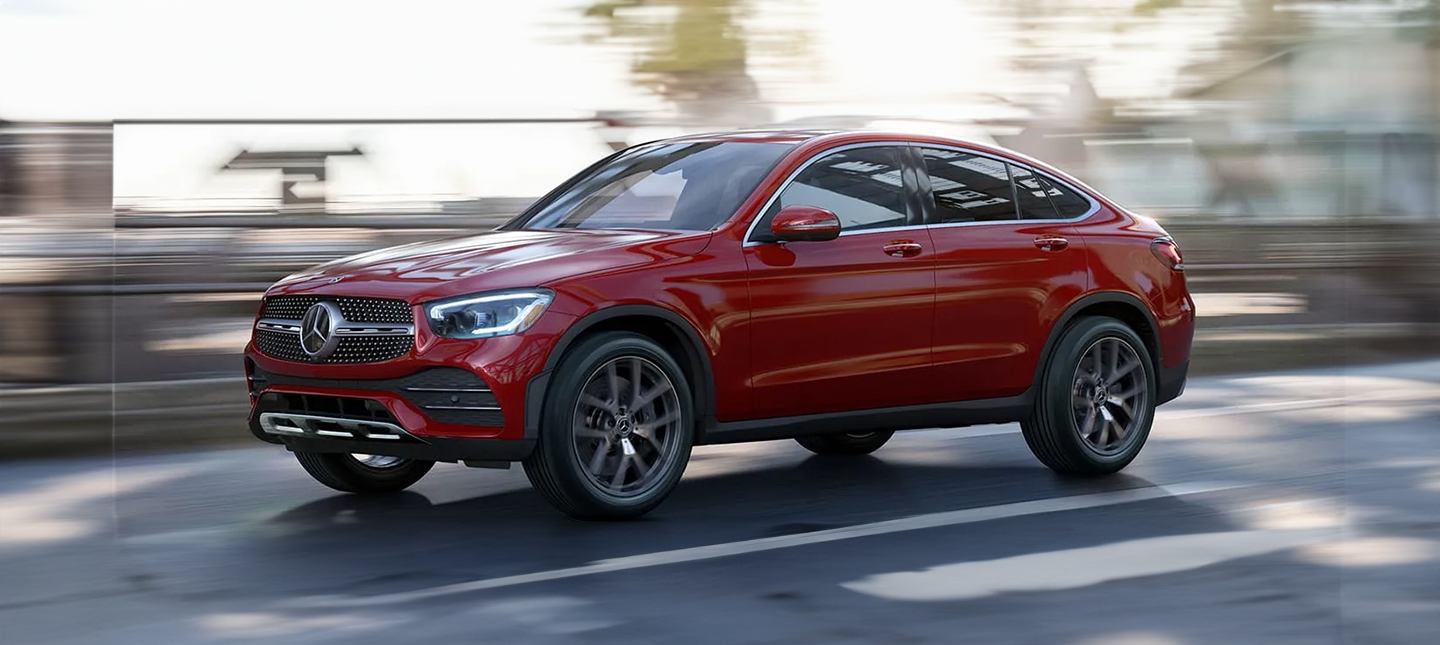 front three-quarter view of a Designo Hyacinth Red Metallic Mercedes-Benz GLC Coupe