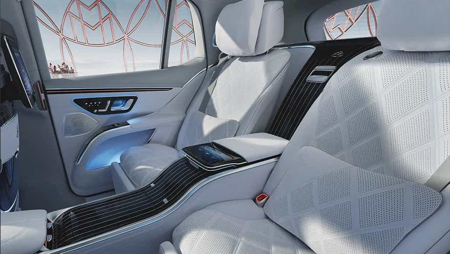 Rear seat luxury interior of a Opalite White Mercedes-Benz Maybach EQS