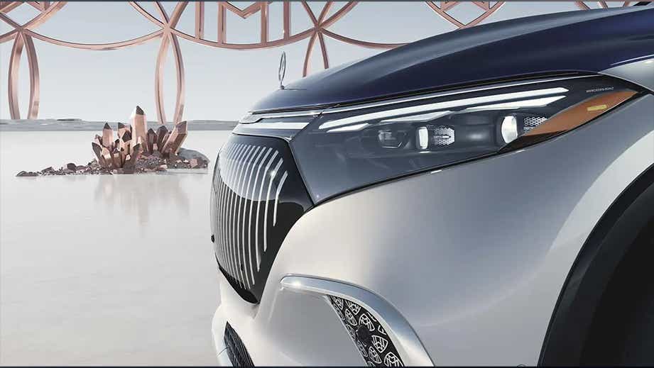 Front grille and headlight of a Opalite White Mercedes-Benz Maybach EQS