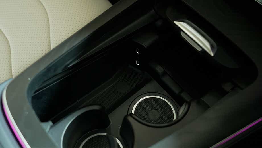 Center console cup holders and USB ports of a Mercedes-Benz E-Class