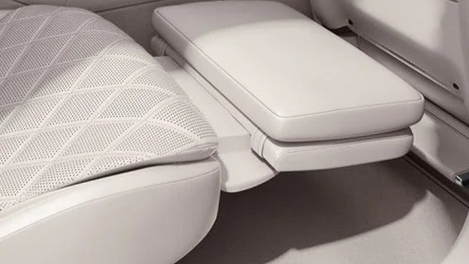 rear seat legrest close-up of a Designo Diamond White Mercedes-Benz S-Class