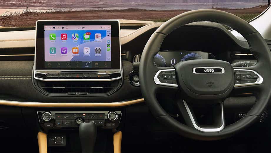 Interior dashboard and steering wheel of a Jeep Meridian