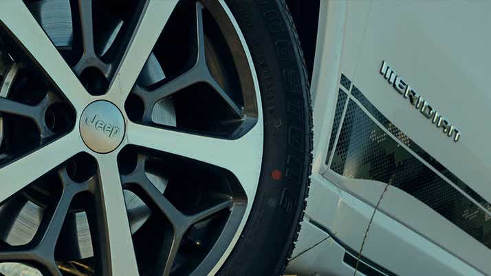 Wheel close-up of a Jeep Meridian