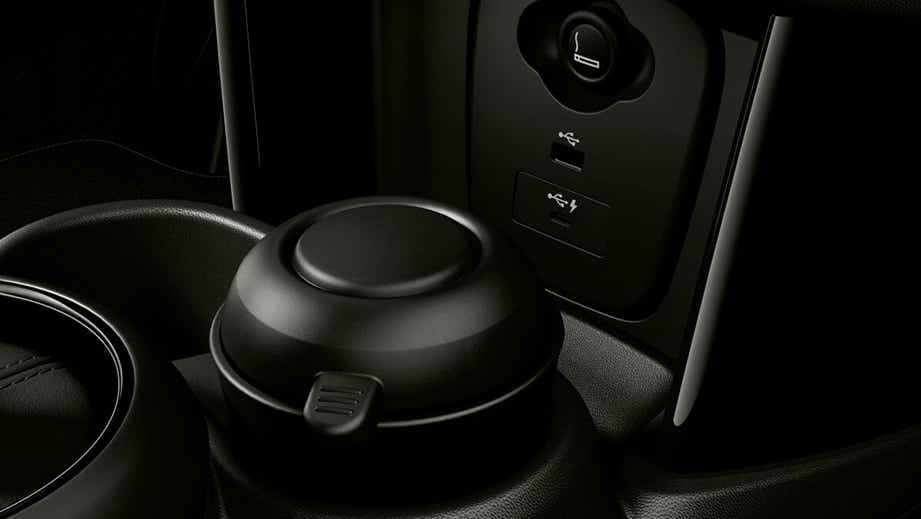 Close-up of cup holders and USB ports in a Mini 3 DOOR