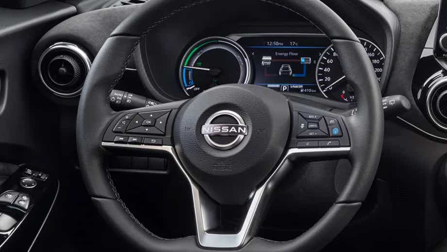 Interior dashboard and steering wheel of a Nissan Juke