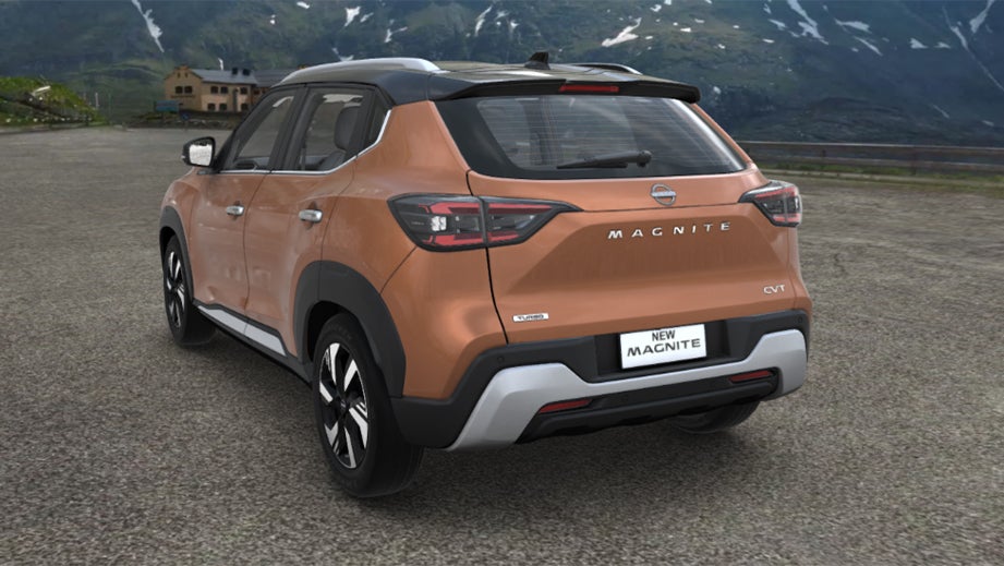 rear three-quarter of a Sunrise Copper Orange Nissan Magnite