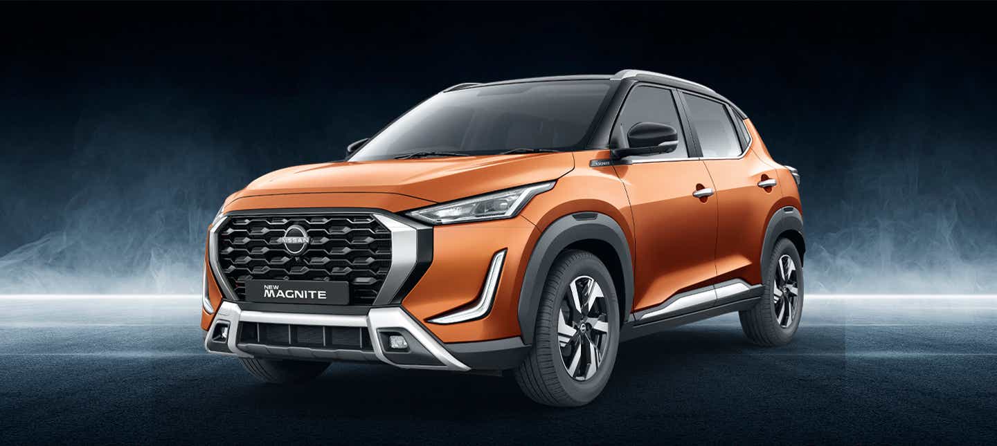 front three-quarter view of a Sunrise Copper Orange Nissan Magnite