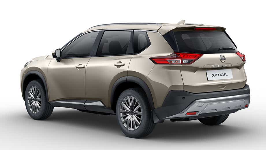 rear three-quarter view of a Champagne Silver Nissan X-Trail