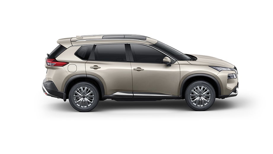 side view of a Champagne Silver Nissan X-Trail