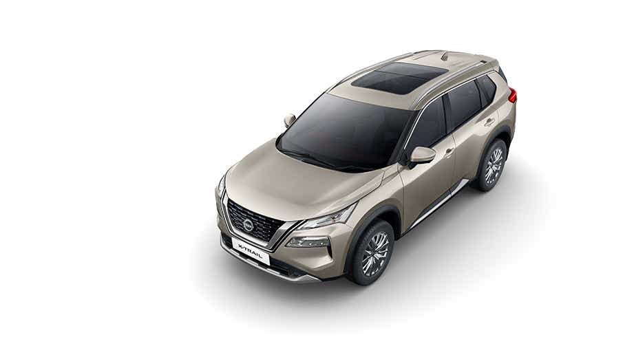 Front three-quarter view of a Champagne Silver Nissan X-Trail
