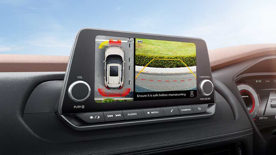 Infotainment screen and parking camera view of a Nissan X-Trail
