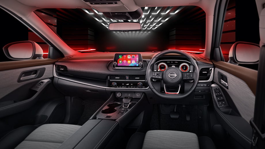 dashboard and steering wheel of a Nissan X-Trail