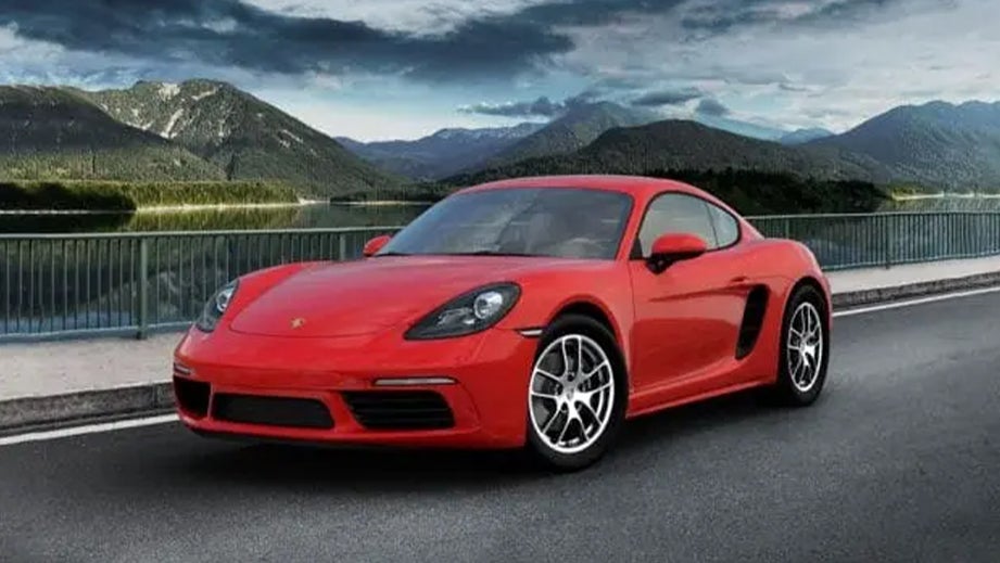 front three-quarter view of a Guards Red Porsche 718