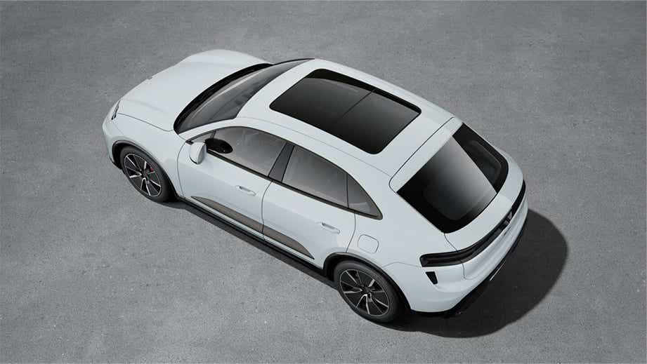 top rear three-quarter view of a White Porsche Macan EV
