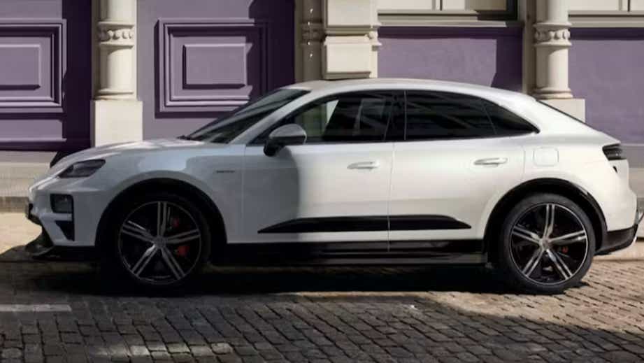 side view of a White Porsche Macan EV