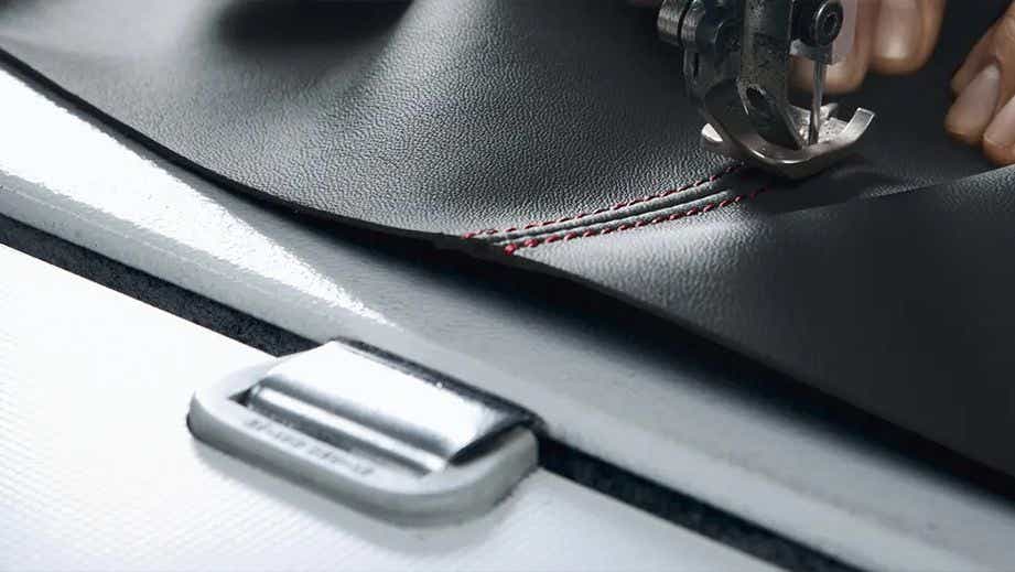 Close-up of leather sewing detail in a Porsche 718