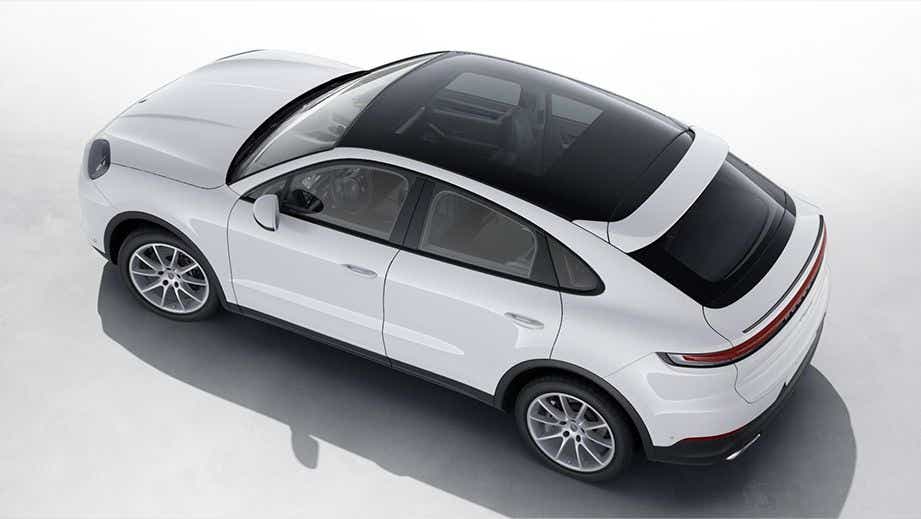 top and rear three-quarter view of a Carrara White Metallic Porsche Cayenne Coupe
