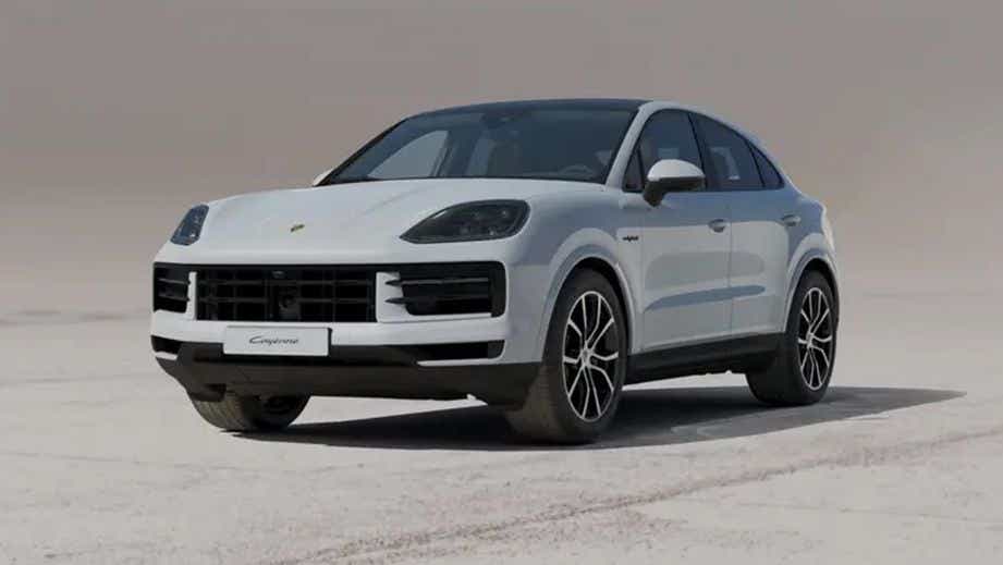 front three-quarter view of a Carrara White Metallic Porsche Cayenne Coupe
