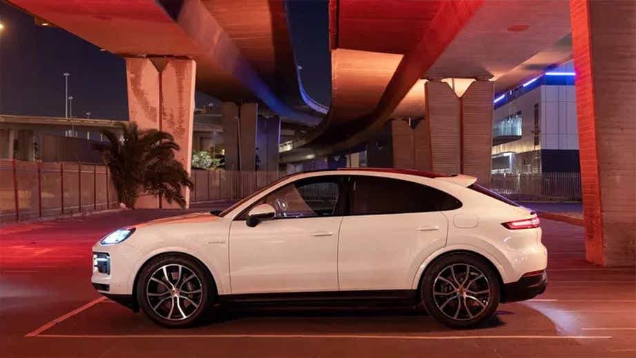 side view of a Carrara White Metallic Porsche Cayenne Coupe
