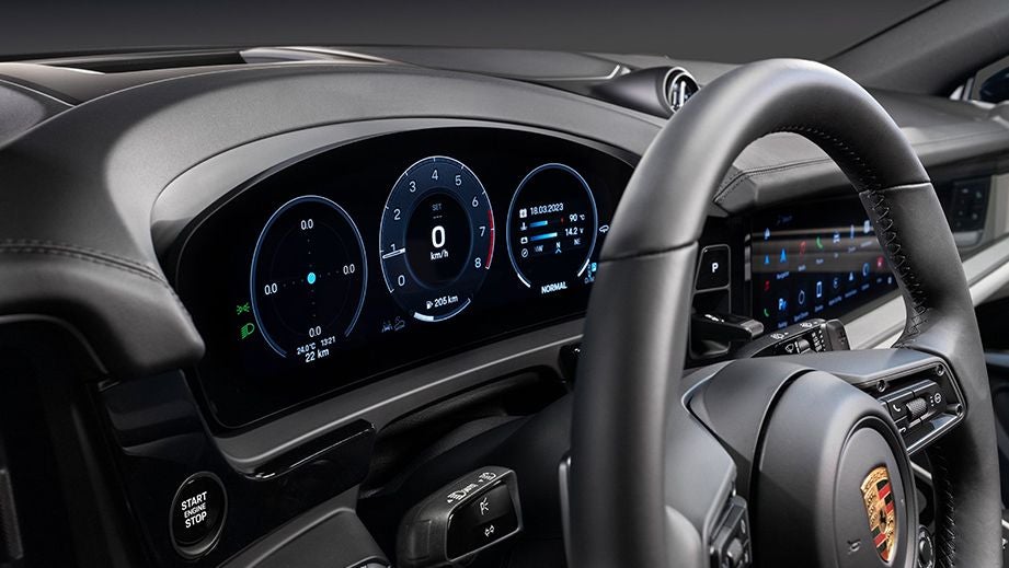 Dashboard and steering wheel view of a Porsche Cayenne