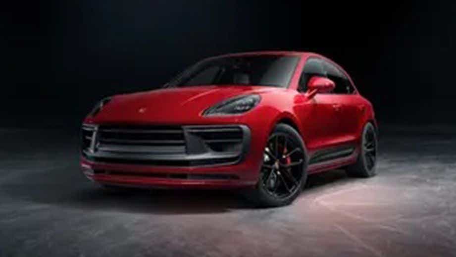 front three-quarter view of a Carmine Red Porsche Macan