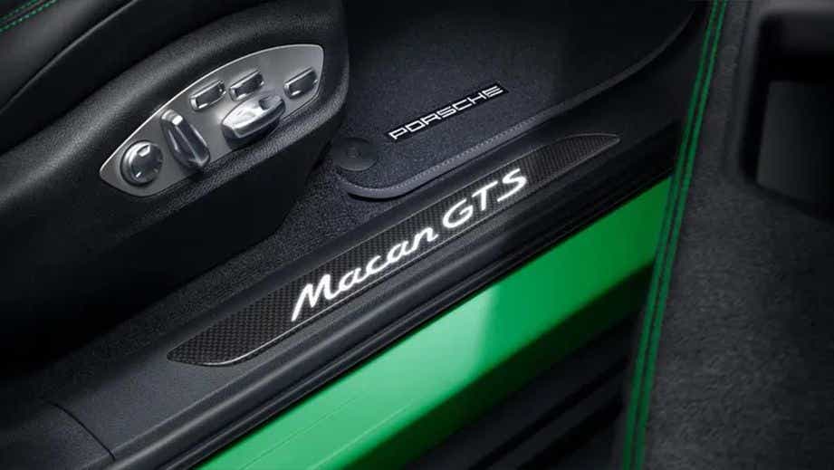 Interior door sill and seat controls of a Porsche Macan GTS