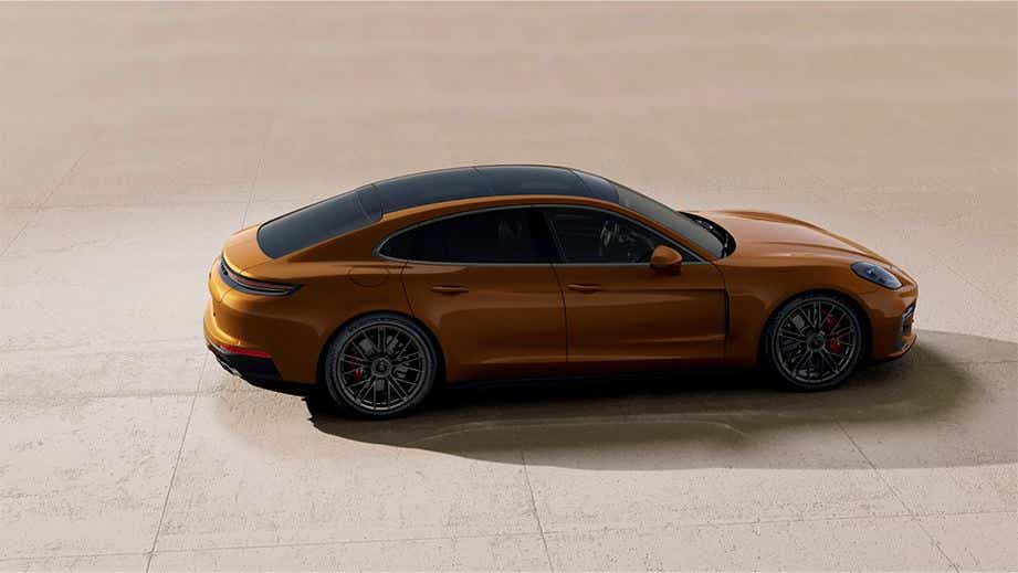 side view of a Madeira Gold Metallic Porsche Panamera