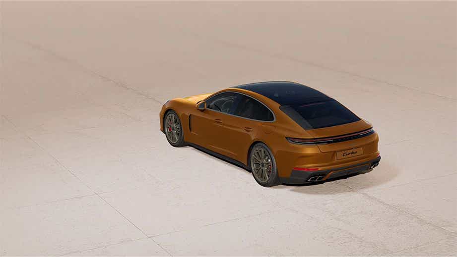 rear three-quarter of a Madeira Gold Metallic Porsche Panamera