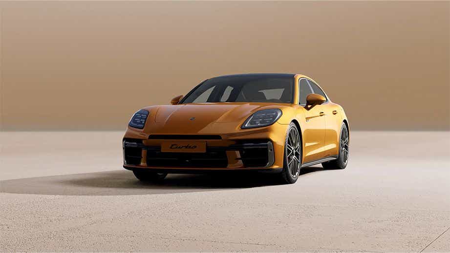 Front three-quarter view of a Madeira Gold Metallic Porsche Panamera