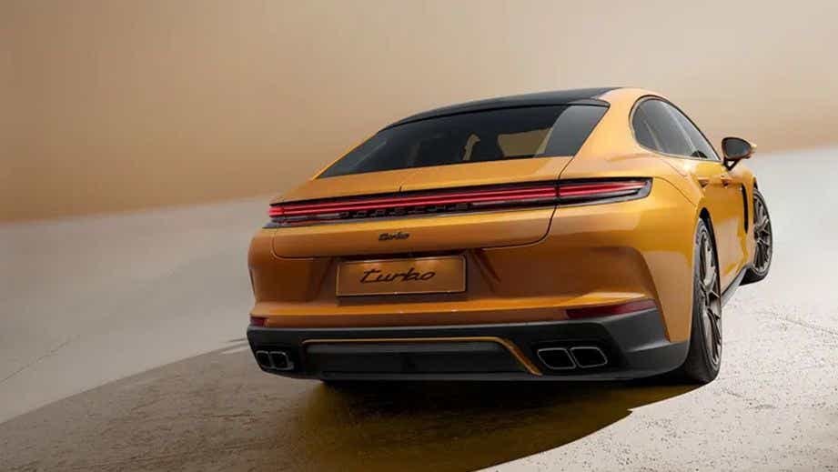 rear three-quarter of a Madeira Gold Metallic Porsche Panamera Turbo