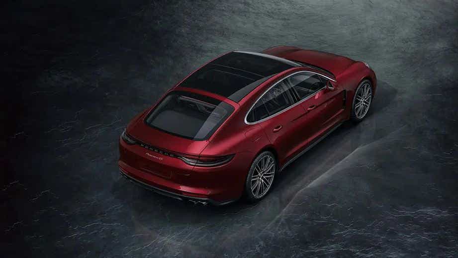 rear three-quarter of a Cherry Metallic Porsche Panamera 2021-2023