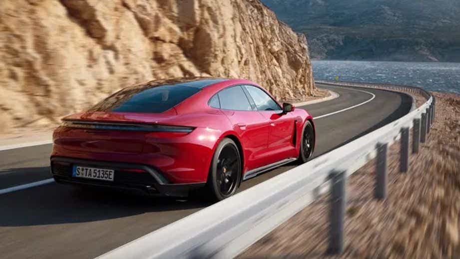rear three-quarter view of a Carmine Red Porsche Taycan