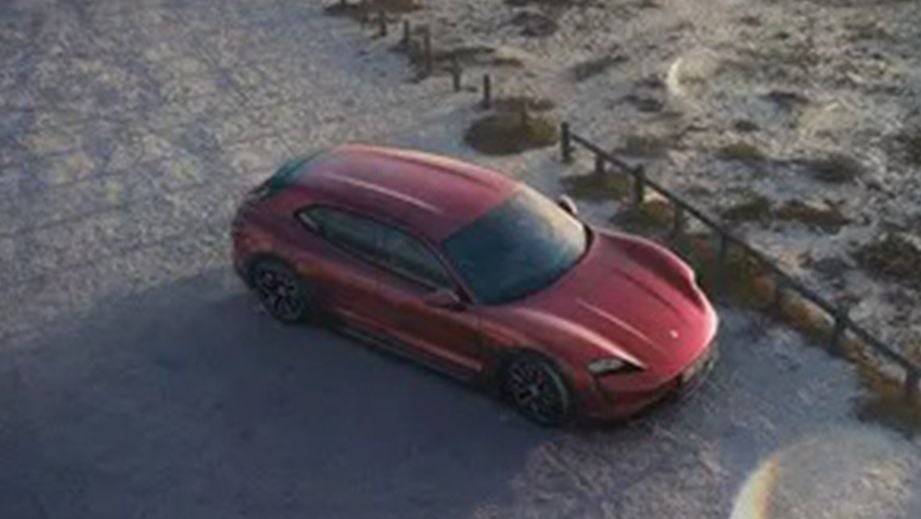 overhead view of a Carmine Red Porsche Taycan