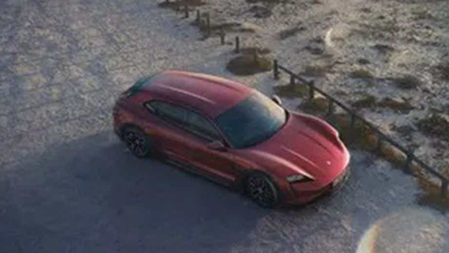 overhead view of a Carmine Red Porsche Taycan