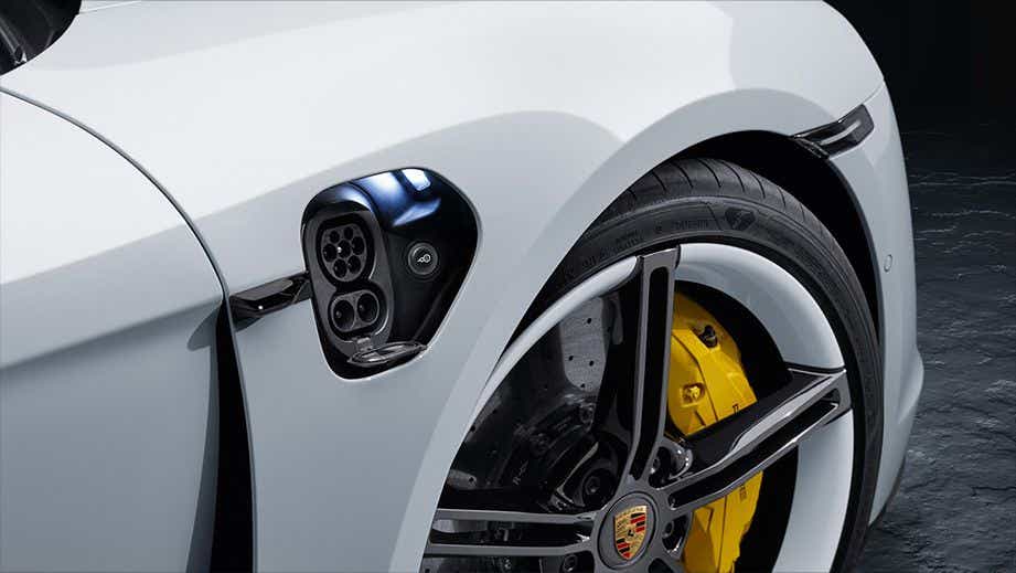 Charging port and front wheel of a Porsche Taycan