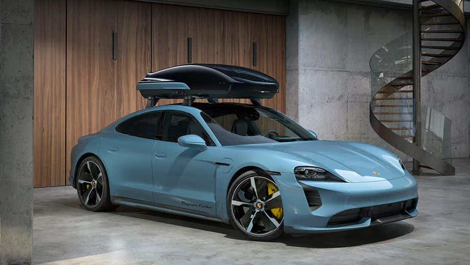 front three-quarter view of a Porsche Taycan parked indoors