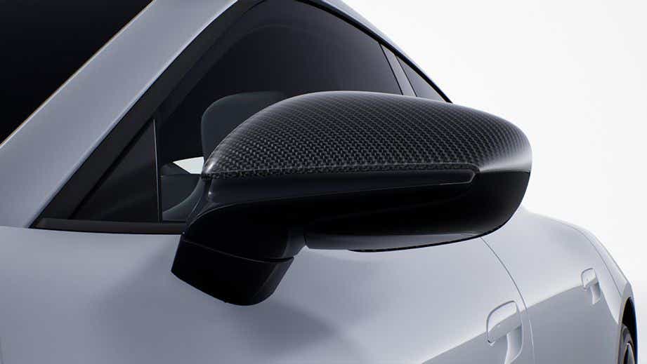 Side mirror close-up of a Porsche Taycan