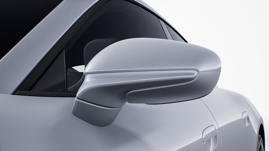 Side mirror close-up of a Porsche Taycan