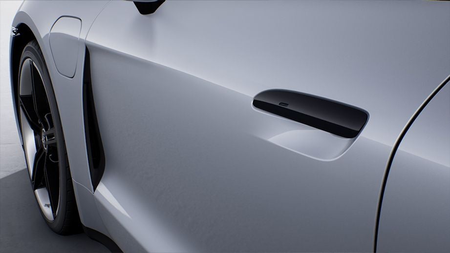 close-up of door handle and wheel on a Porsche Taycan