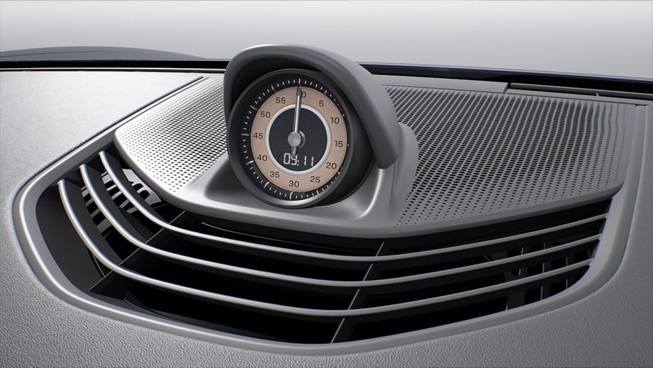 Dashboard clock close-up of a Porsche Taycan