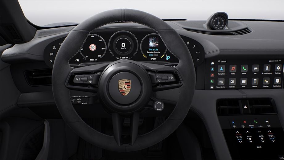 Steering wheel and dashboard of a Porsche Taycan