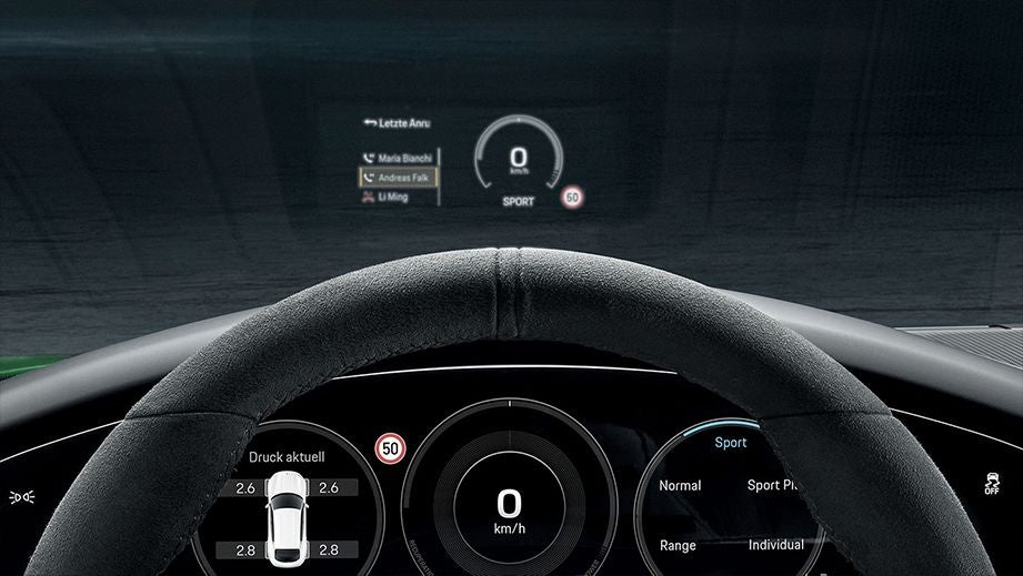 dashboard and steering wheel view of a Porsche Taycan