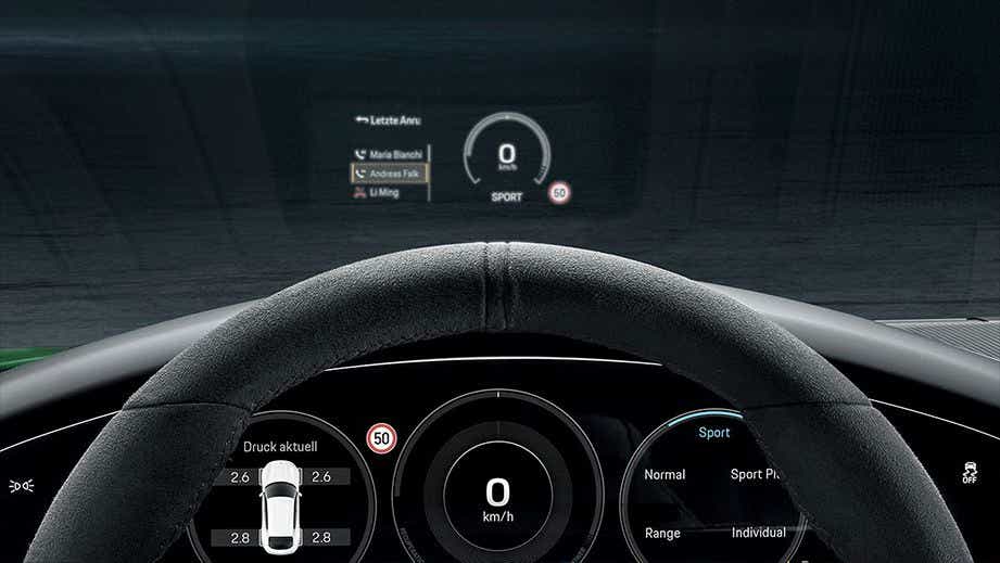 dashboard and steering wheel view of a Porsche Taycan