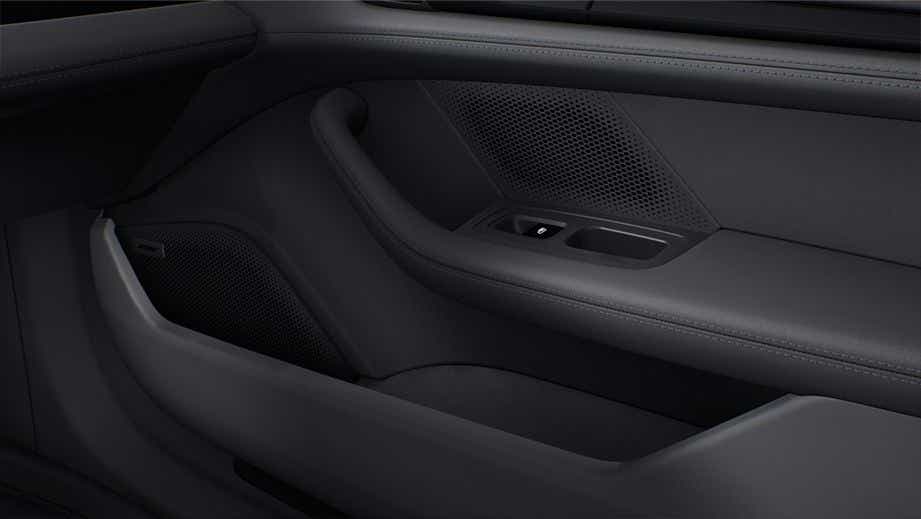 close-up of the interior door panel of a Porsche Taycan