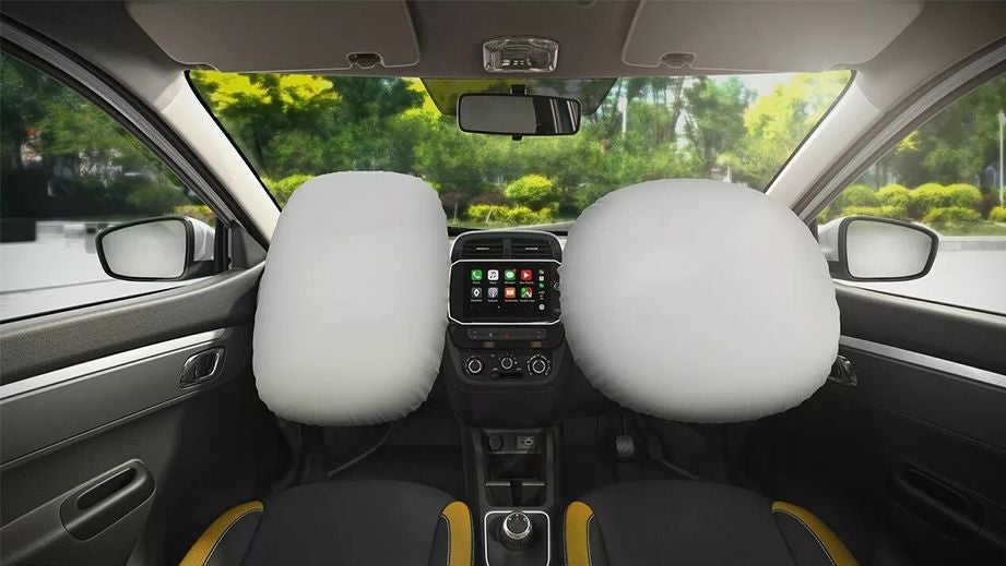 Interior dashboard view with deployed airbags of a Renault KWID