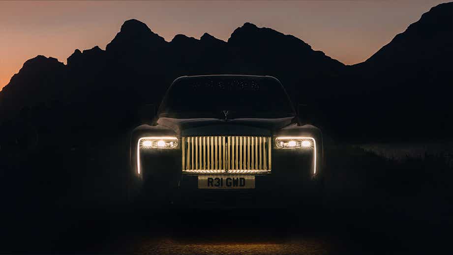 Front view of a Rolls-Royce Cullinan Series II at dusk